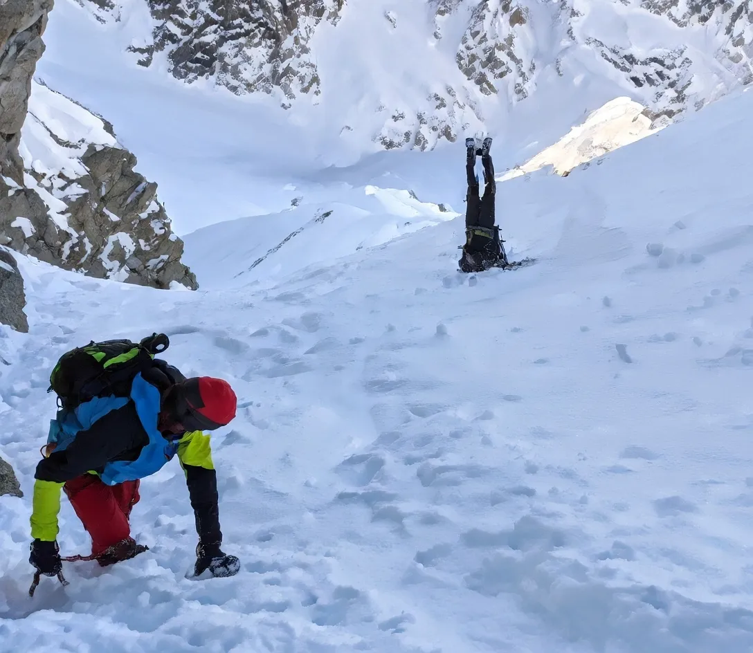 CLIMBER'S SLIP Terrifying moment mountaineer slips and uncontrollably hurtles down snowy mountain as onlookers scream in terror